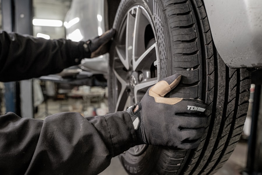 Auto technician changing tires at customer location in South Bay